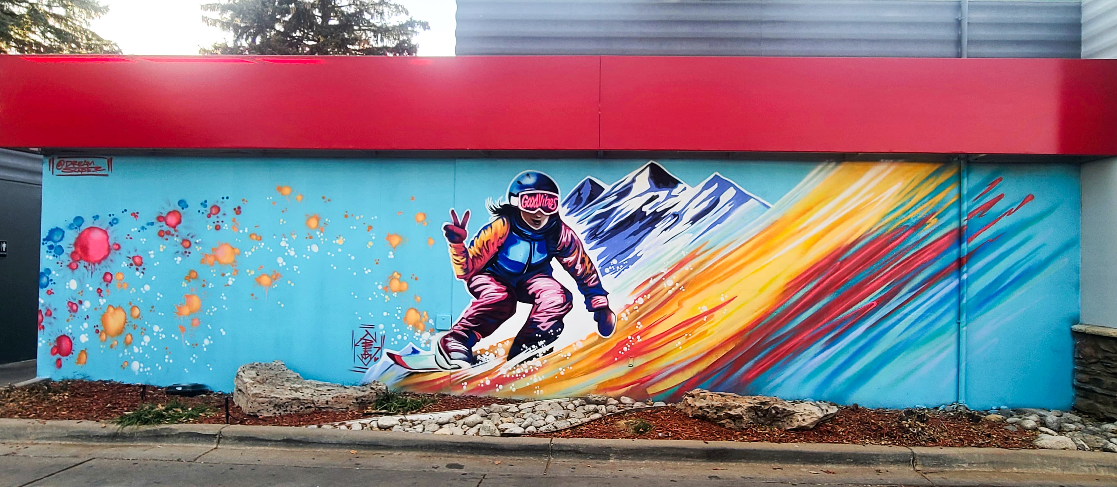 Snowboarder on Turquoise Wall — gallery image 1